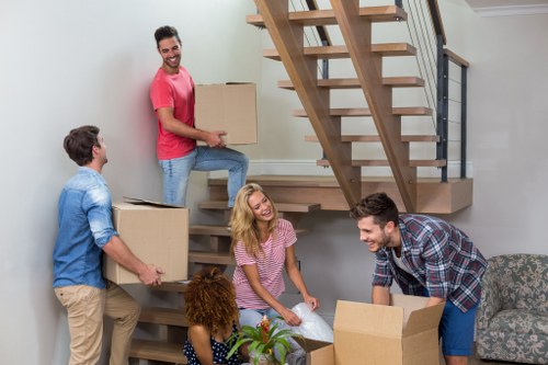 Professional office relocation planning in Merton with moving boxes and workspace setup