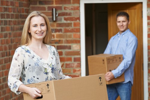 Planning home moves in Merton with packed boxes and moving van