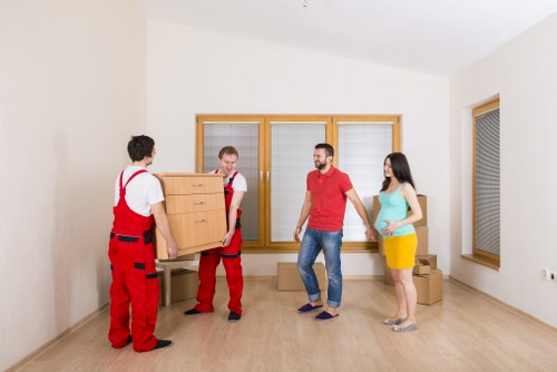 Flat removals planning in Merton with boxes and moving equipment