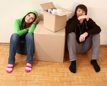 Van unloading boxes during student removals in Merton