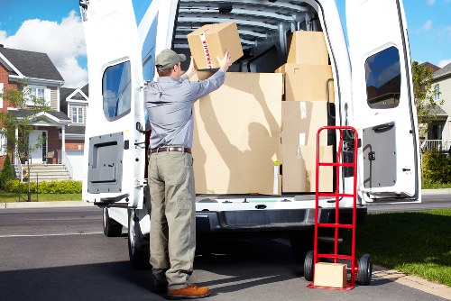 Secure loading of a piano into a removals vehicle for transport in Merton