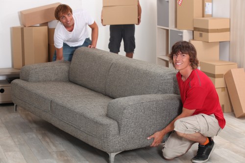 Business moving team handling office relocation services in Merton with careful packing