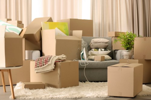 Movers handling furniture safely during a house removal in Merton