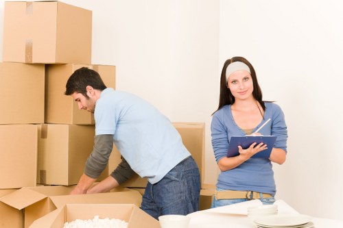 Packed moving boxes ready for removals in Merton