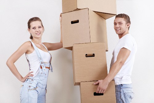 Packed moving boxes and transport van for Merton removals
