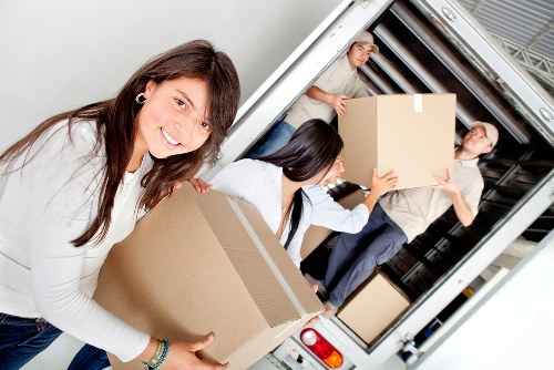 Merton moving team loading household furniture into a van