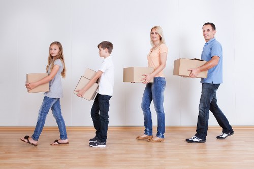 Removal team carrying student furniture in Merton